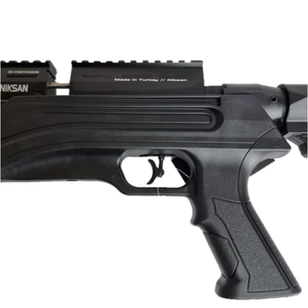 A pistol grip and adjustable trigger on the Niksan Ozark-TS PCP 5.5mm.