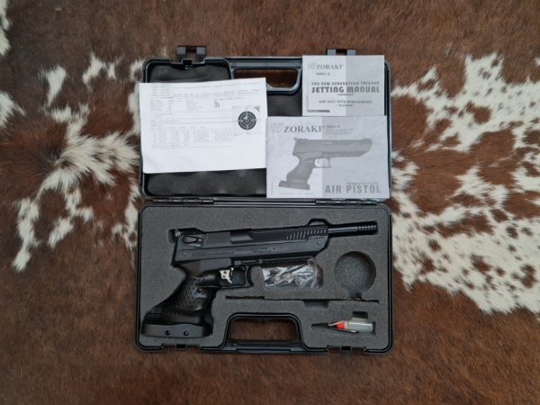 The Zoraki HP01-2 Ultra Pneumatic Pellet Pistol in it's hard case, with extras.
